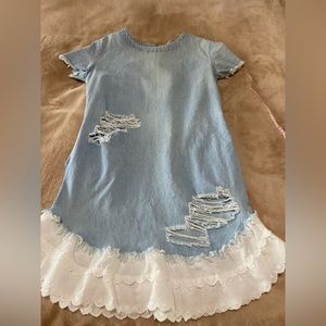 A’GACI distressed, jean dress with unique trim around the bottom.